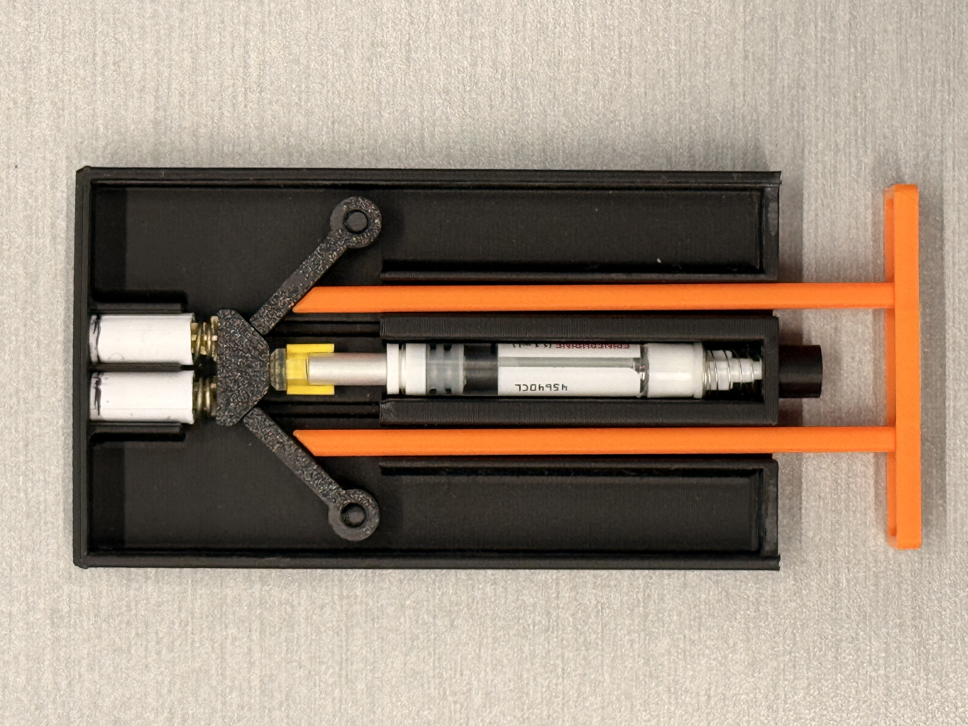 Internal mechanism prototype, redesigned cartridge, spring assembly, and orange release frame